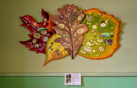Photo of giant leaf artwork on wall