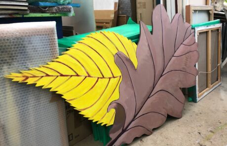 Image of a giant brown leaf and a giant yellow leaf