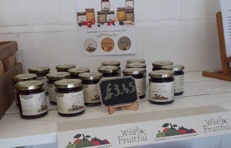 Photo of shelf in farm shop with jars