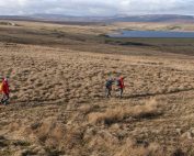 Walkers walking near Balderhead Reservoir on the Roof of England Walk.