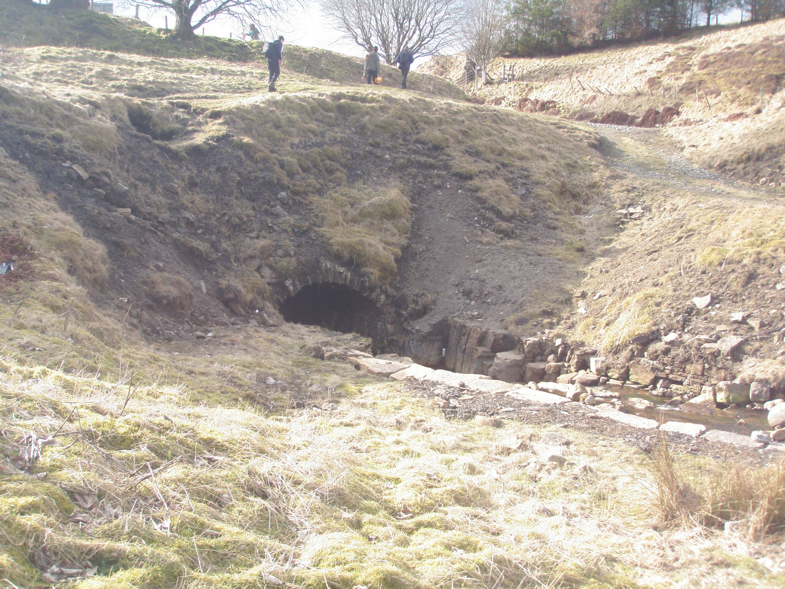 Mine at Nenthead lead mine with trees and people in the background
